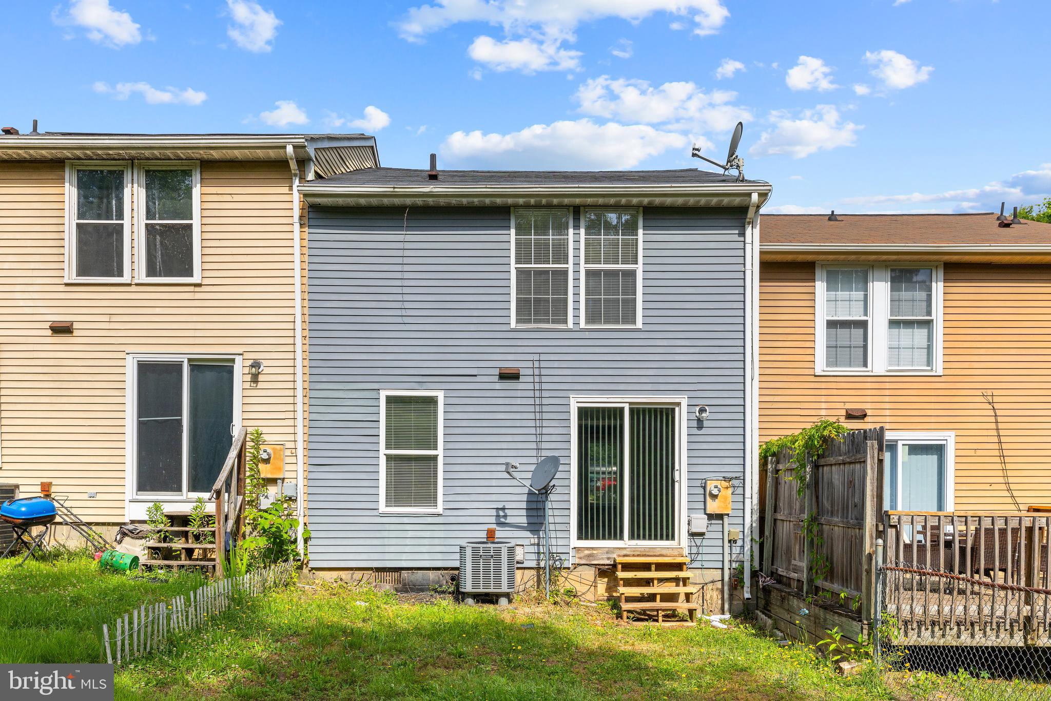 9479 Inaugural Drive King George, VA 22485 - Photo 22 of 26 a front view of a house with a yard