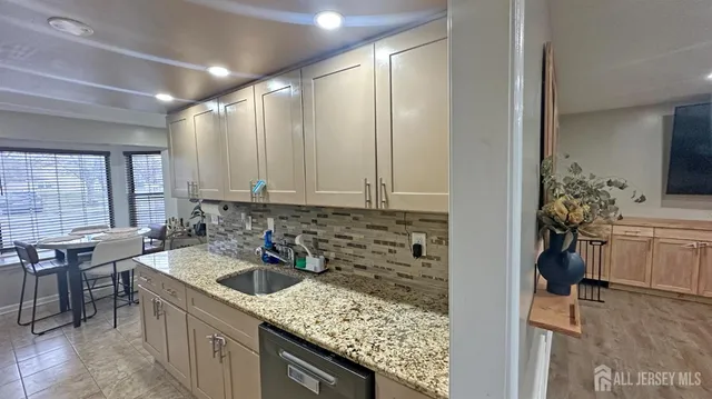 a kitchen with a sink and cabinets