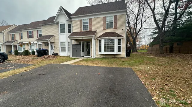 a view of a white house with a large windows