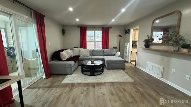 a living room with furniture and a large window