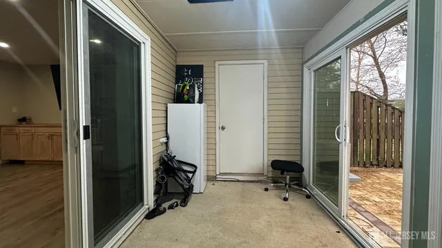 a view of room with furniture and windows