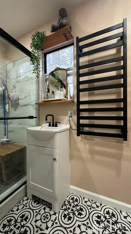 a room with a walk in closet and a mirror