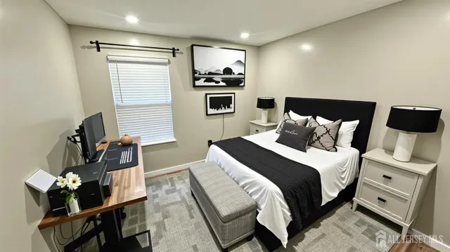 a bedroom with a bed and furniture