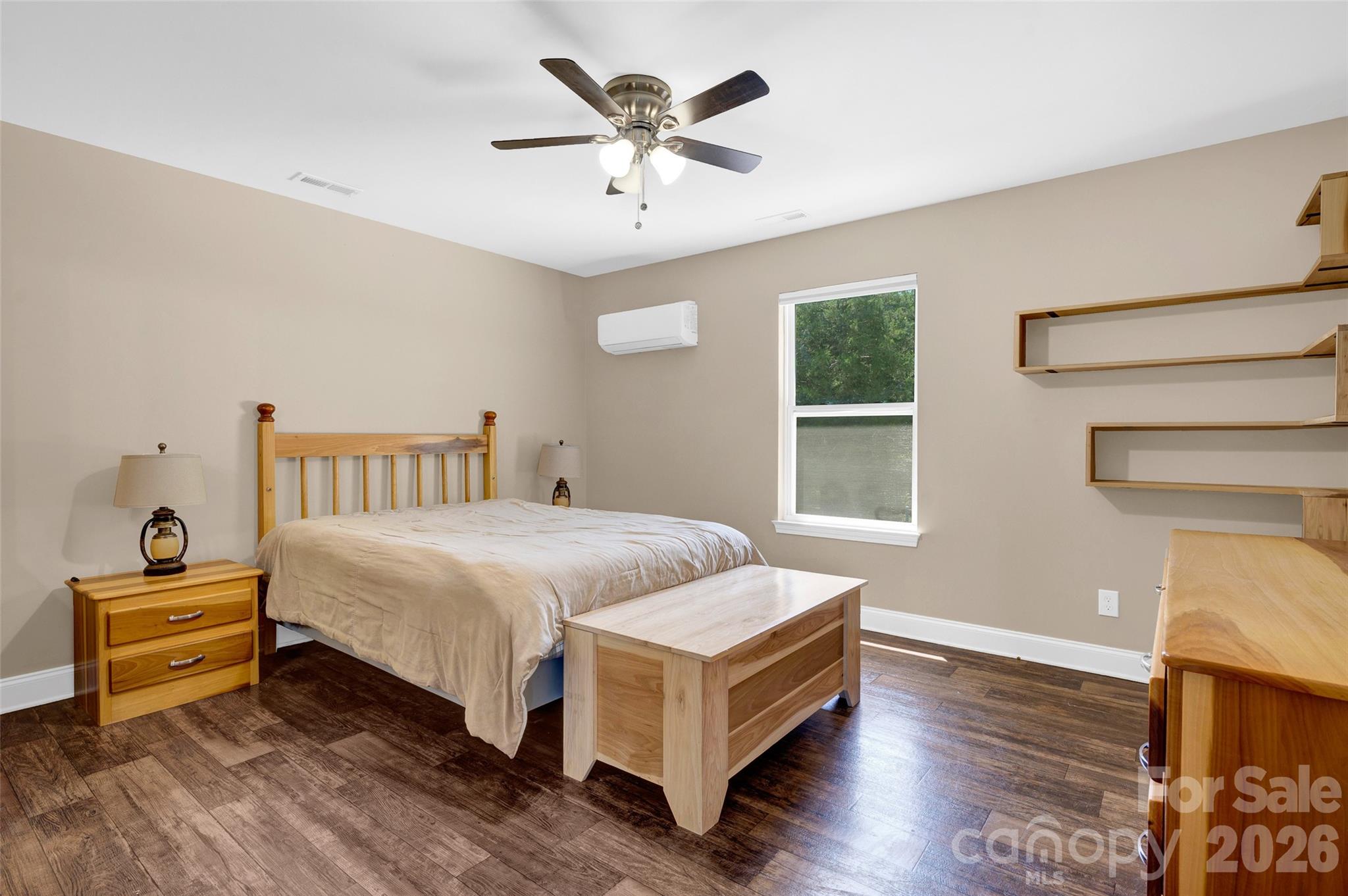 359 Rash Road Olin, NC 28660 - Photo 17 of 46 a bedroom with a bed and window