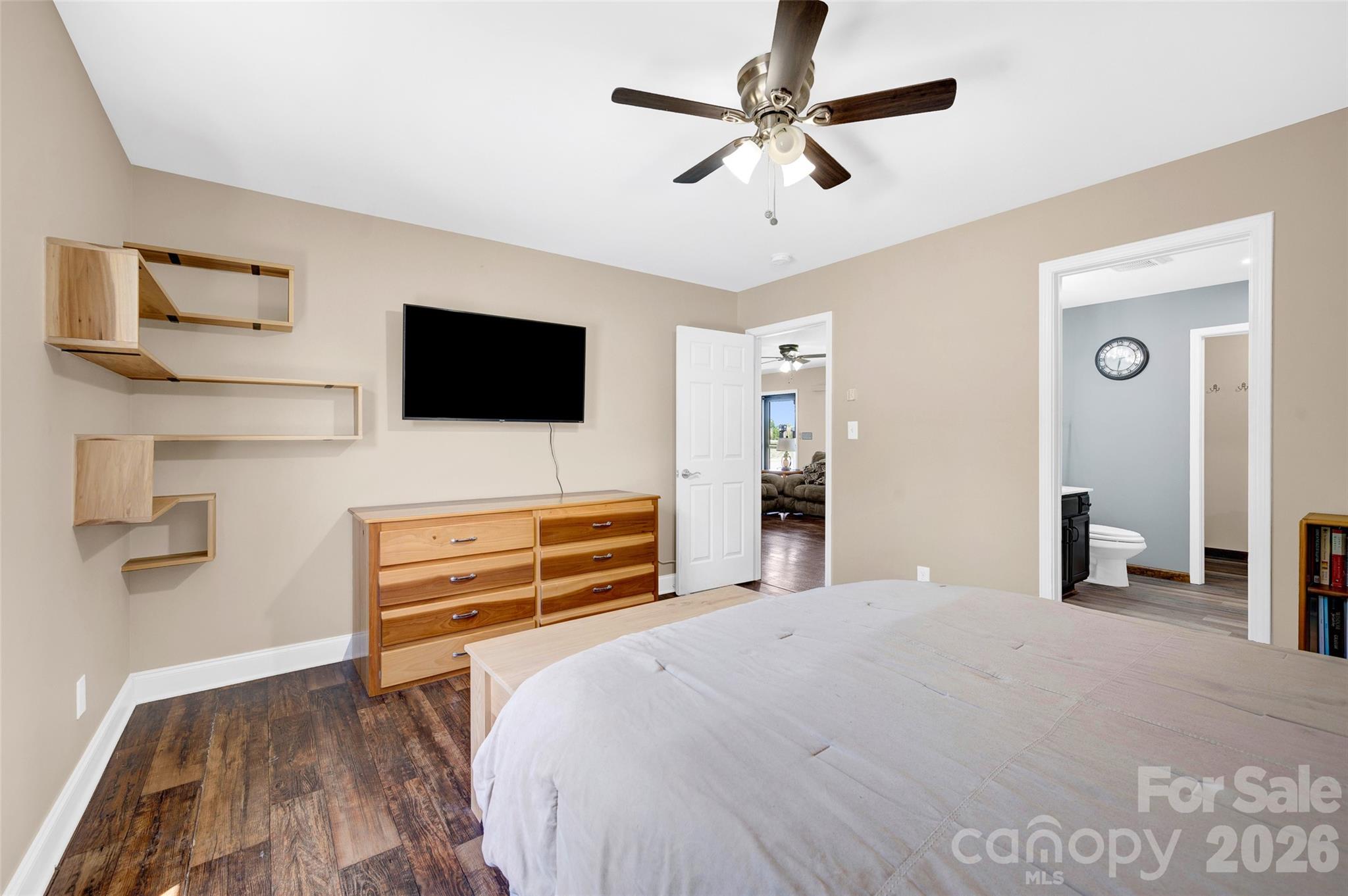 359 Rash Road Olin, NC 28660 - Photo 18 of 46 a bedroom with a bed and a flat screen tv
