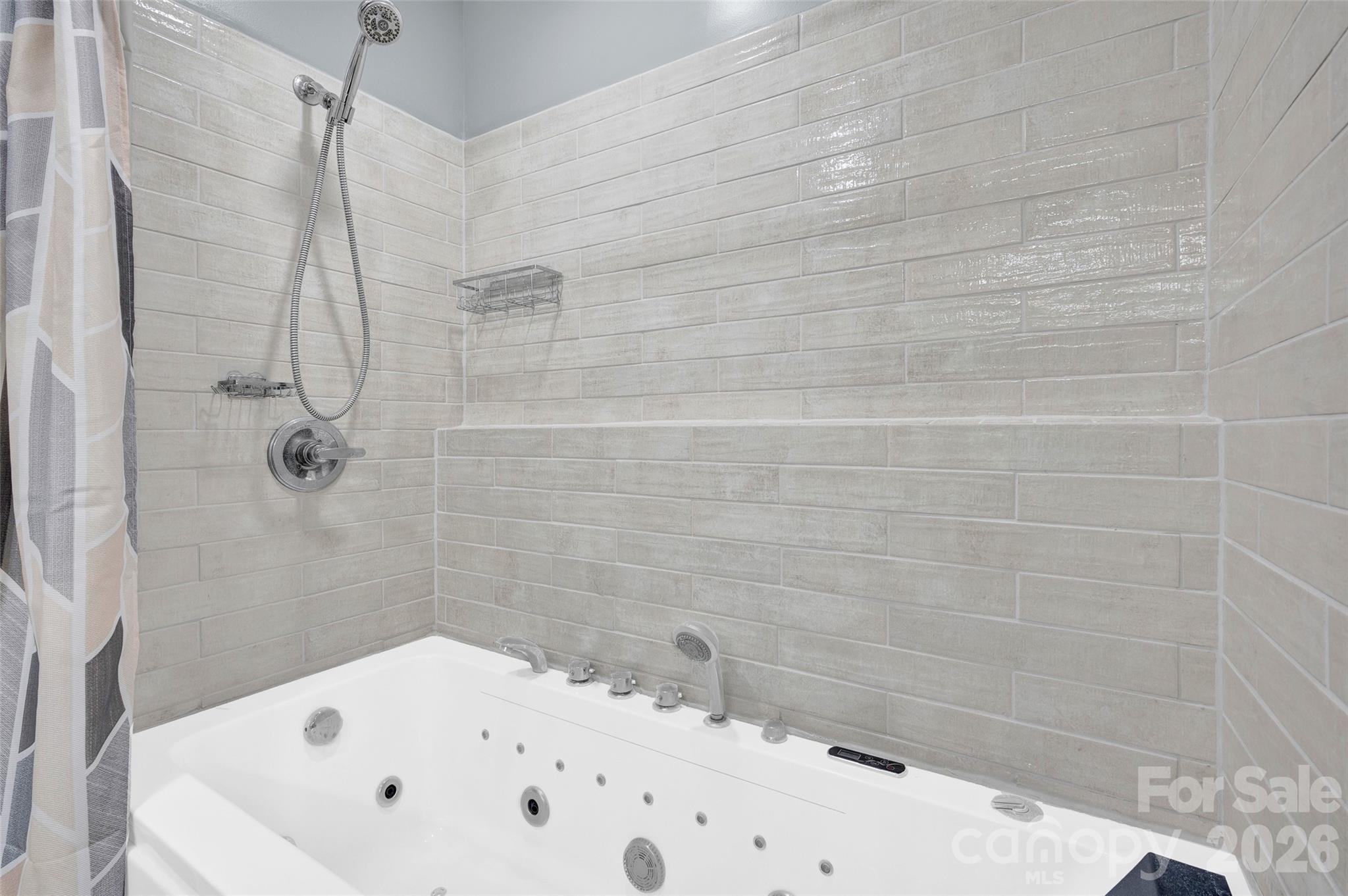 359 Rash Road Olin, NC 28660 - Photo 21 of 46 a bathroom with a bathtub and shower