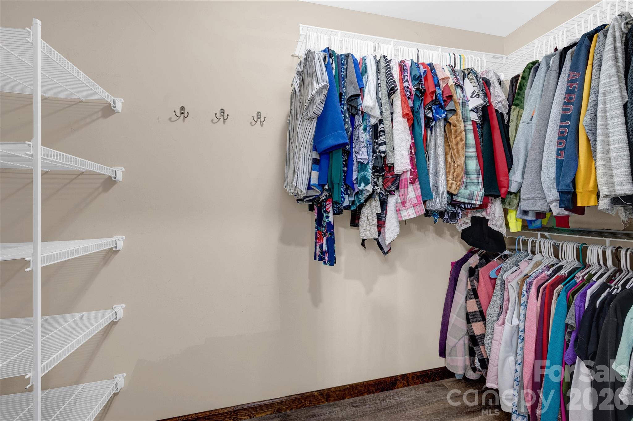 359 Rash Road Olin, NC 28660 - Photo 22 of 46 a view of walk in closet with clothes