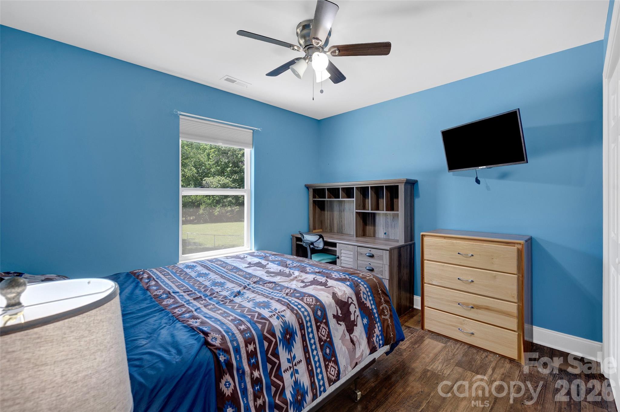 359 Rash Road Olin, NC 28660 - Photo 23 of 46 a bedroom with a bed and a flat screen tv