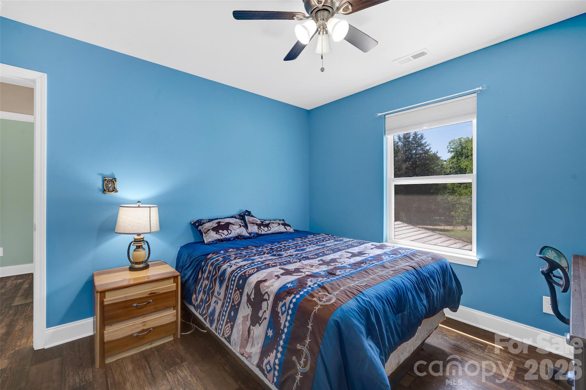 359 Rash Road Olin, NC 28660 - Photo 24 of 46 a bedroom with a bed and a window