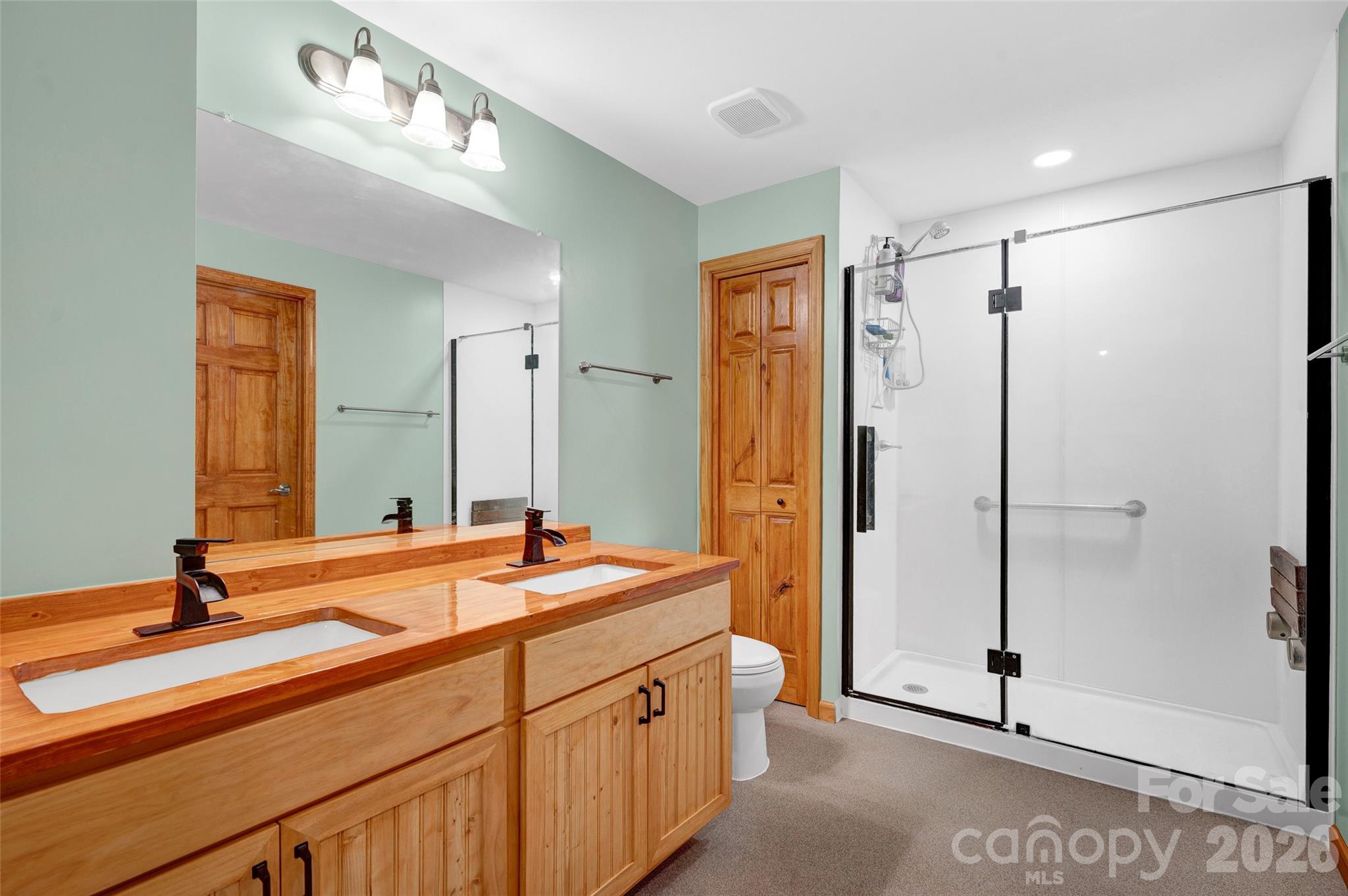 359 Rash Road Olin, NC 28660 - Photo 33 of 46 a bathroom with a double vanity sink mirror and double