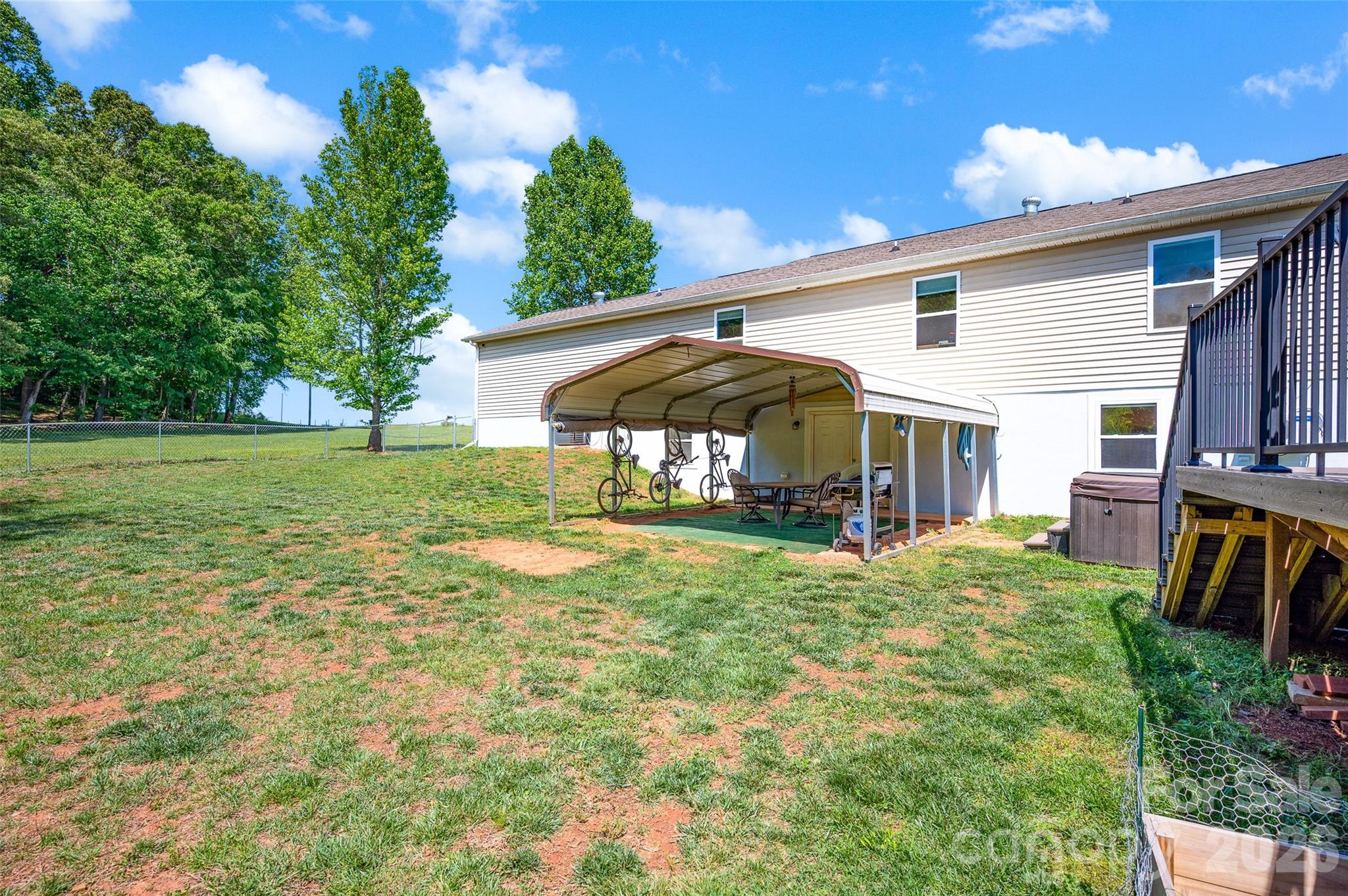 359 Rash Road Olin, NC 28660 - Photo 39 of 46 a view of a house with backyard and sitting area