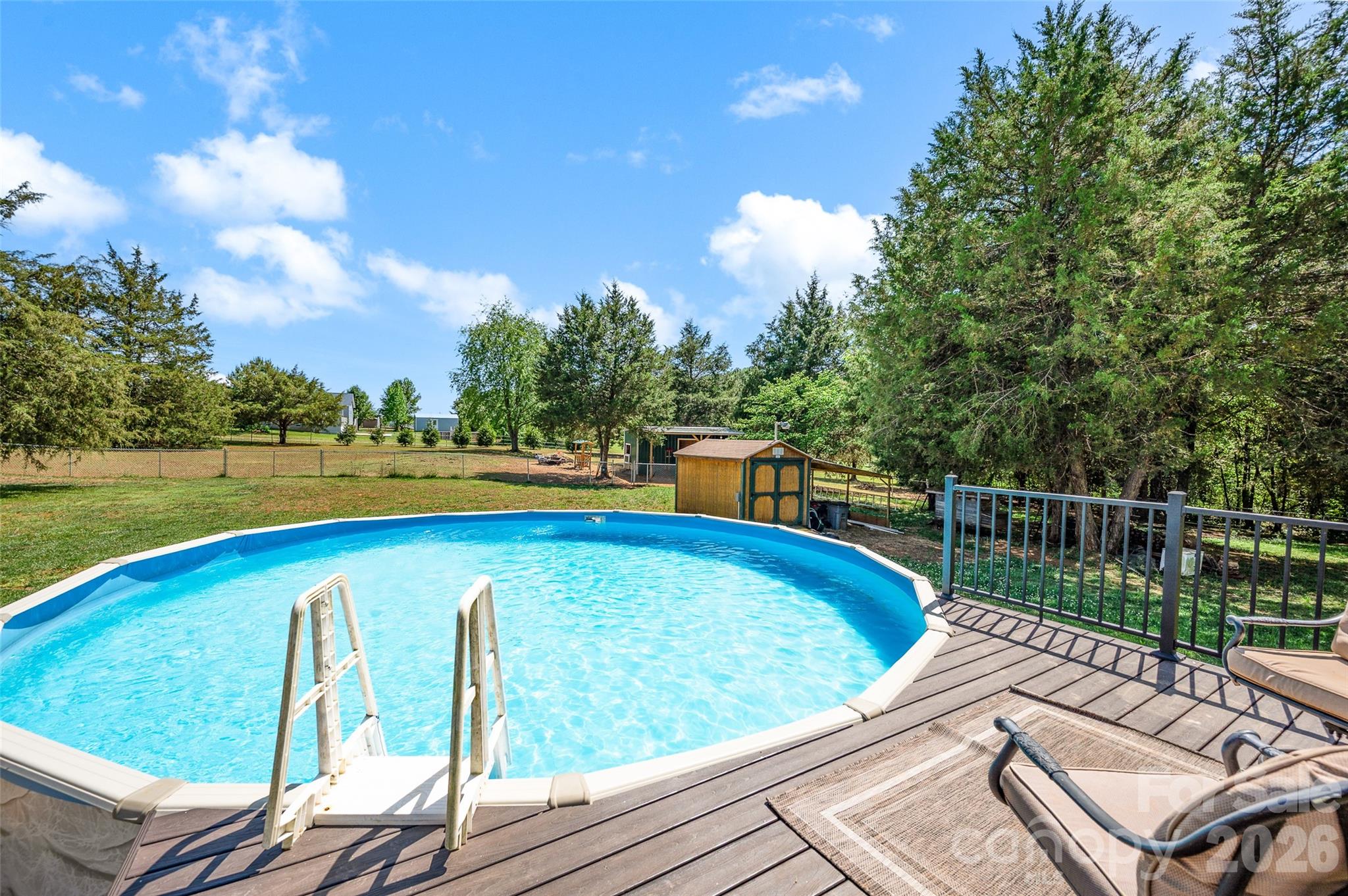 359 Rash Road Olin, NC 28660 - Photo 41 of 46 a view of a swimming pool with a patio