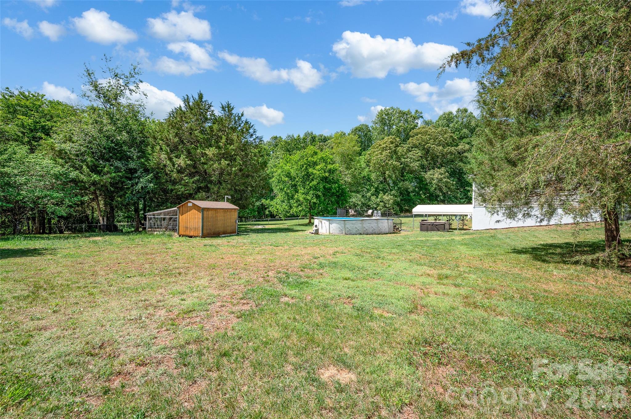 359 Rash Road Olin, NC 28660 - Photo 42 of 46 a backyard of a house with table and chairs