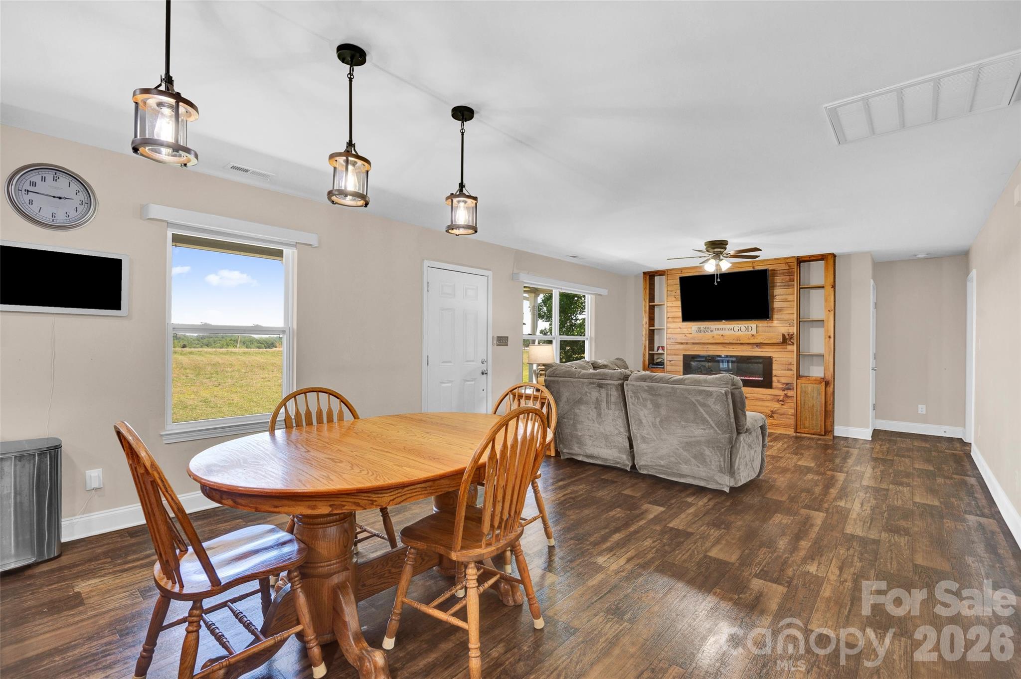 359 Rash Road Olin, NC 28660 - Photo 6 of 46 a view of a dining room with furniture and wooden floor