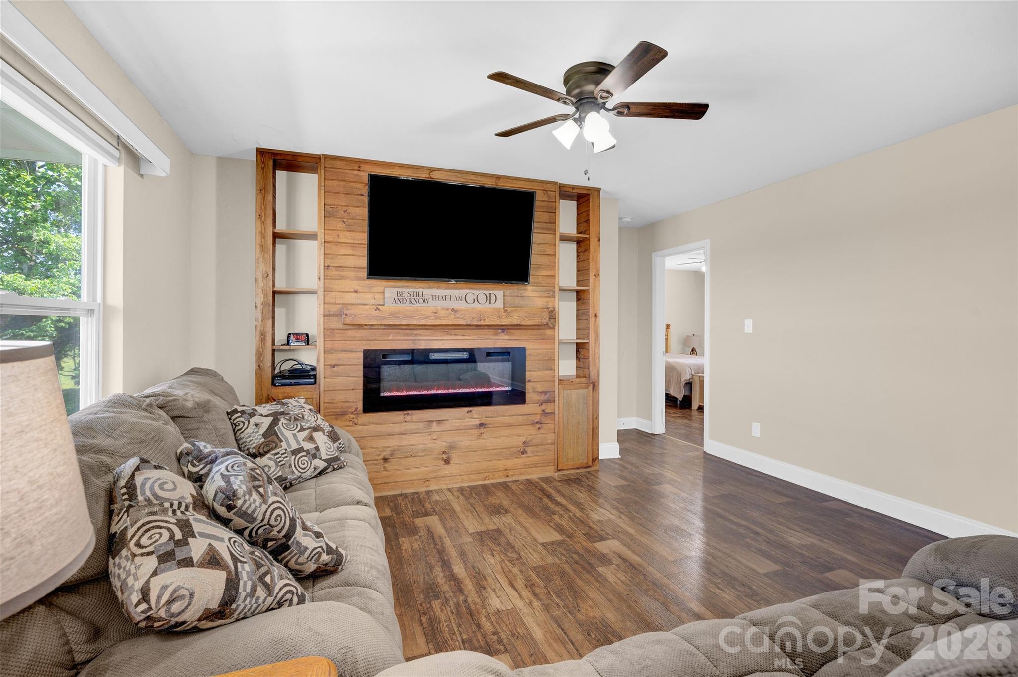 359 Rash Road Olin, NC 28660 - Photo 10 of 46 a living room with furniture fireplace and flat screen tv