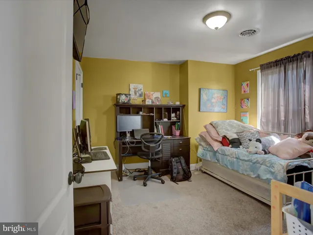 a view of a hallway with stairs