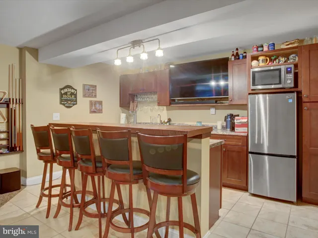 a large kitchen with a table and chairs
