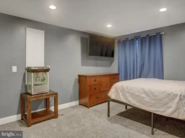 a bathroom with a toilet a sink and a mirror