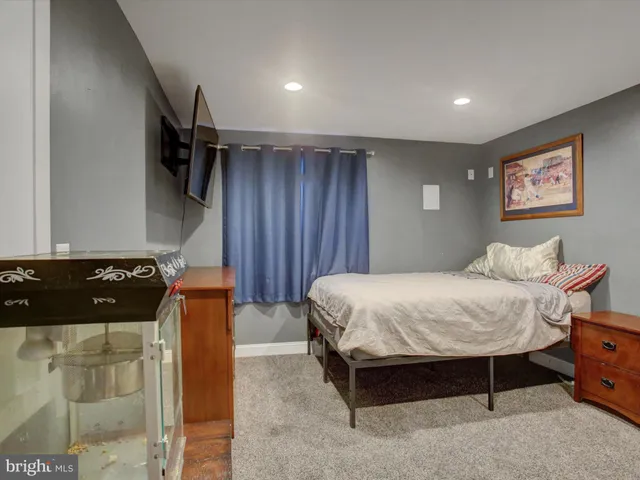 a room with lots of different colored cloths and lots of stuff