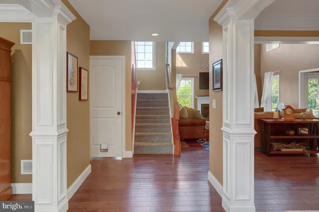 a view of a living room and wooden floor