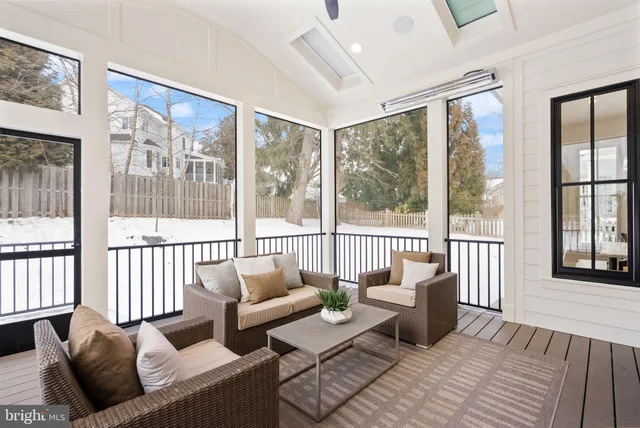 a large kitchen with kitchen island a stove a sink a center island a dining table and chairs