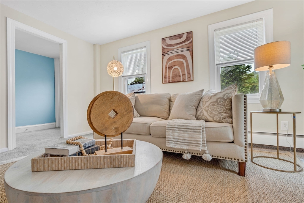 27 Water Street, Unit 27 Concord, MA 01742 - Photo 4 of 20 a living room with furniture and a lamp