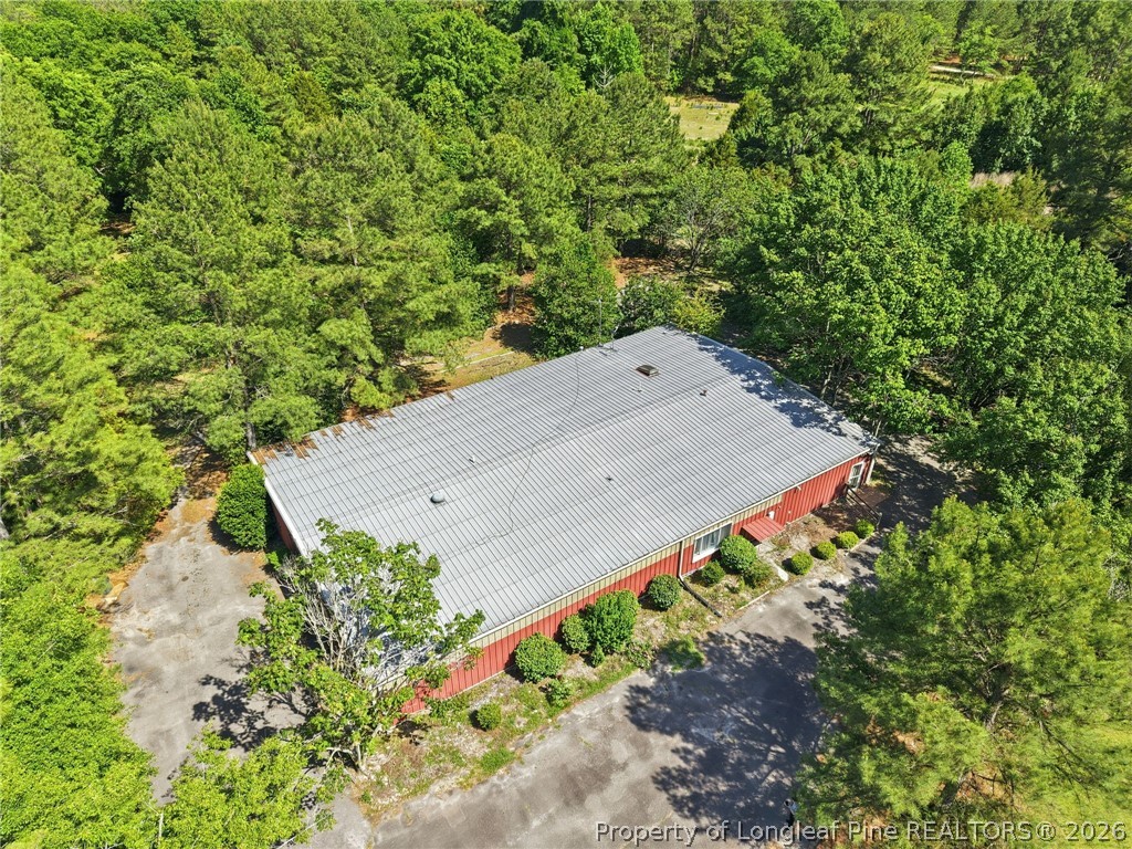 478 Rattlesnake Trail Aberdeen, NC 28315 - Photo 9 of 44 an aerial view of a house with a yard and covered with trees