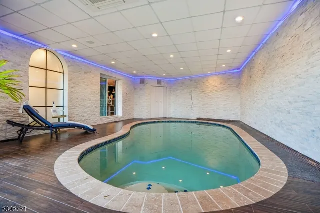 a room with wooden floor and outdoor seating