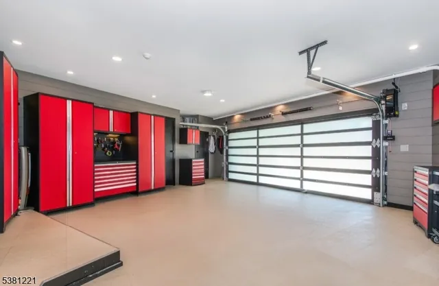 a view of an empty room with a window and a ceiling fan