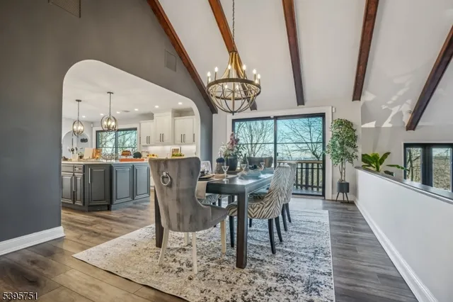 a view of a dining room with furniture wooden floor and a rug