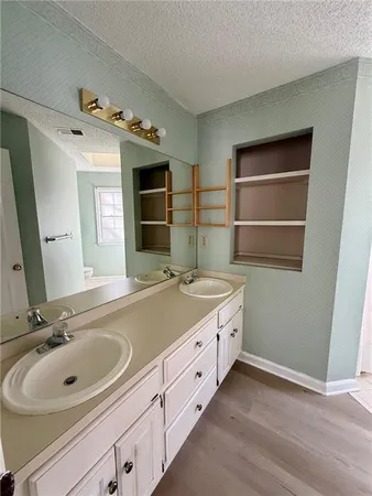 a bathroom with a sink and a large mirror