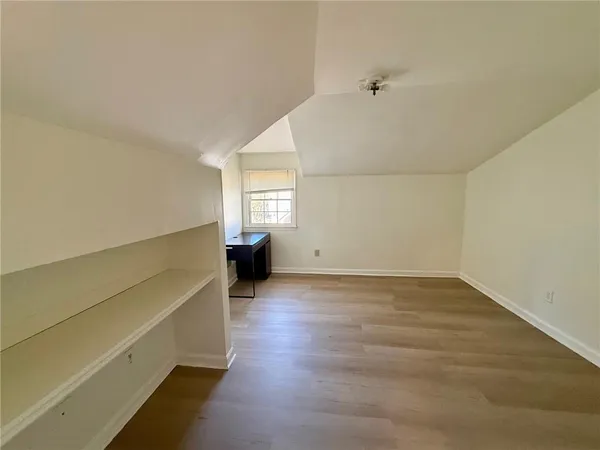 an entryway with wooden floor