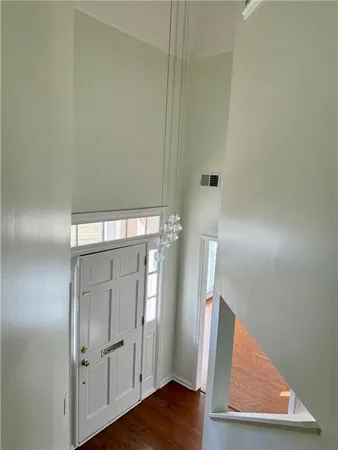 a view of a livingroom with wooden floor