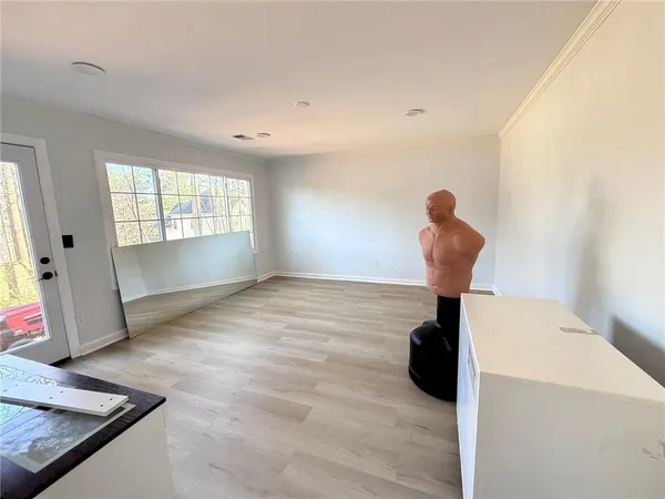 a view of an empty room with a window