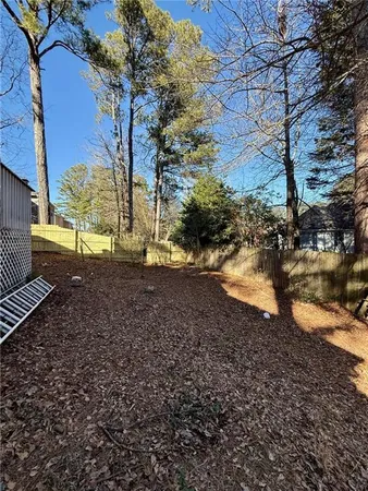 a view of a yard with a tree