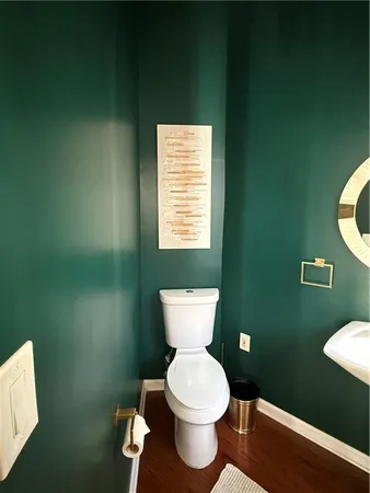a bathroom with a toilet and a sink