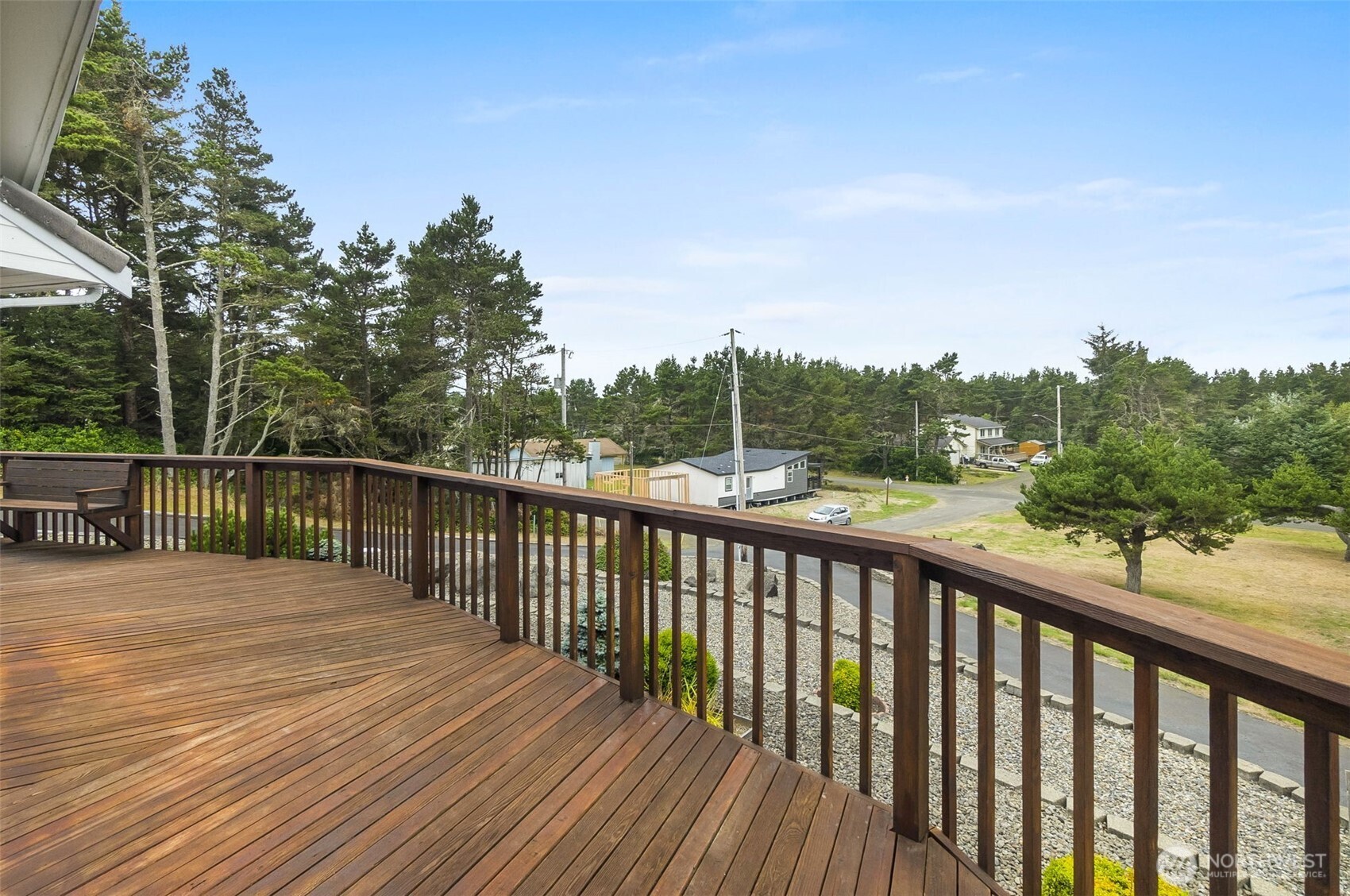 280 Surf Street Westport, WA 98595 - Photo 11 of 35 a balcony with wooden floor and fence