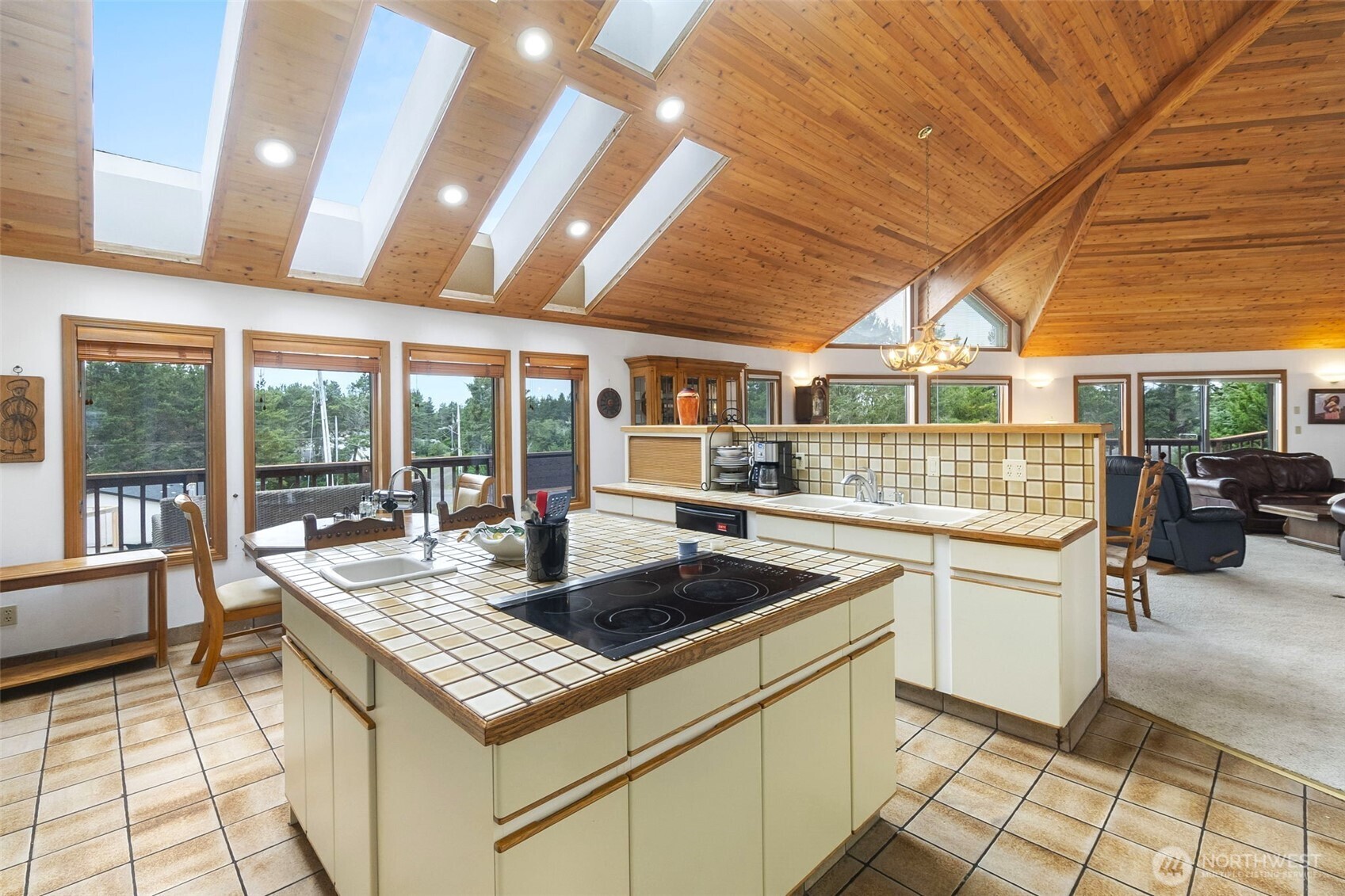 280 Surf Street Westport, WA 98595 - Photo 13 of 35 a kitchen with a sink and large windows