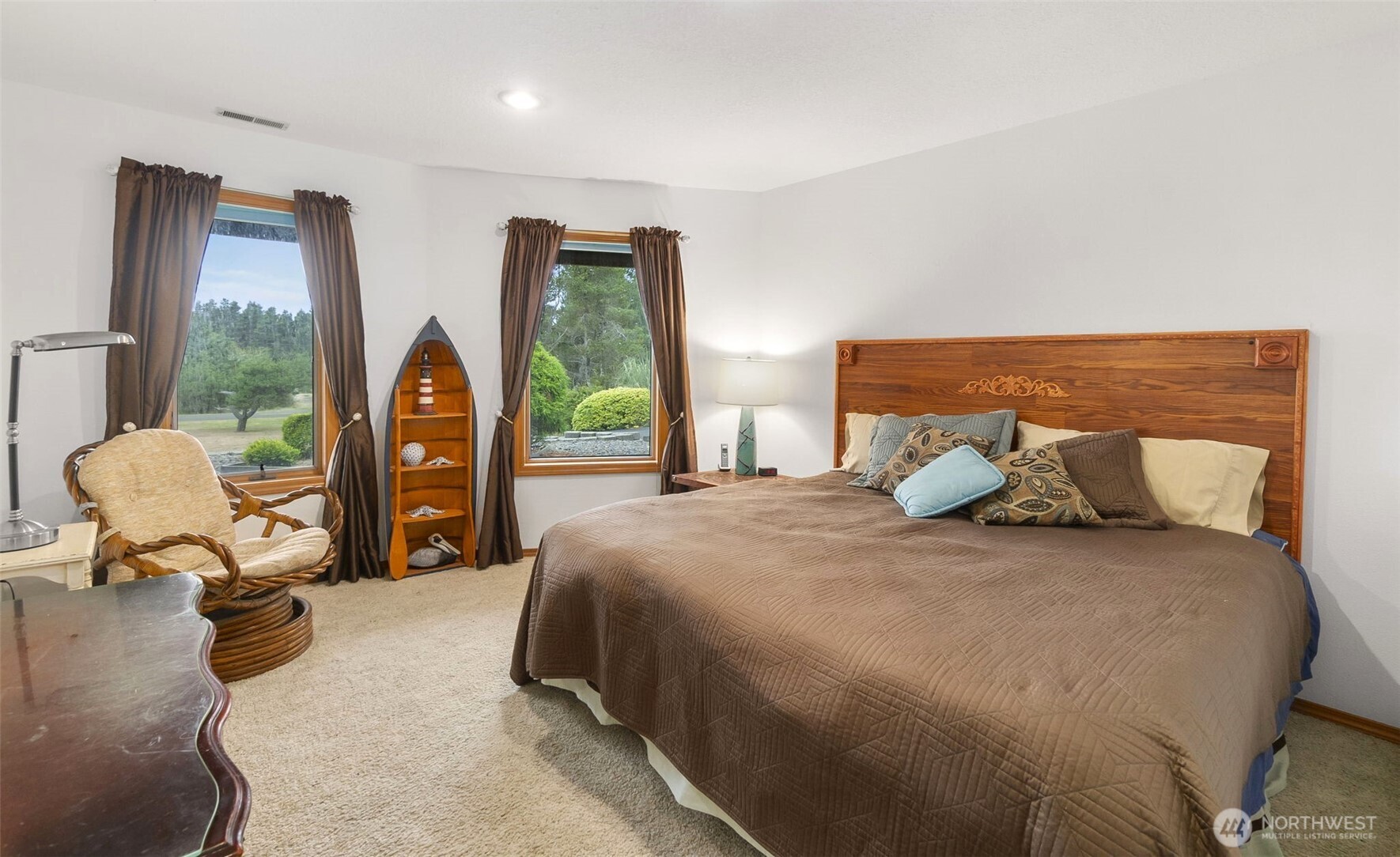 280 Surf Street Westport, WA 98595 - Photo 27 of 35 a bedroom with a bed and large windows
