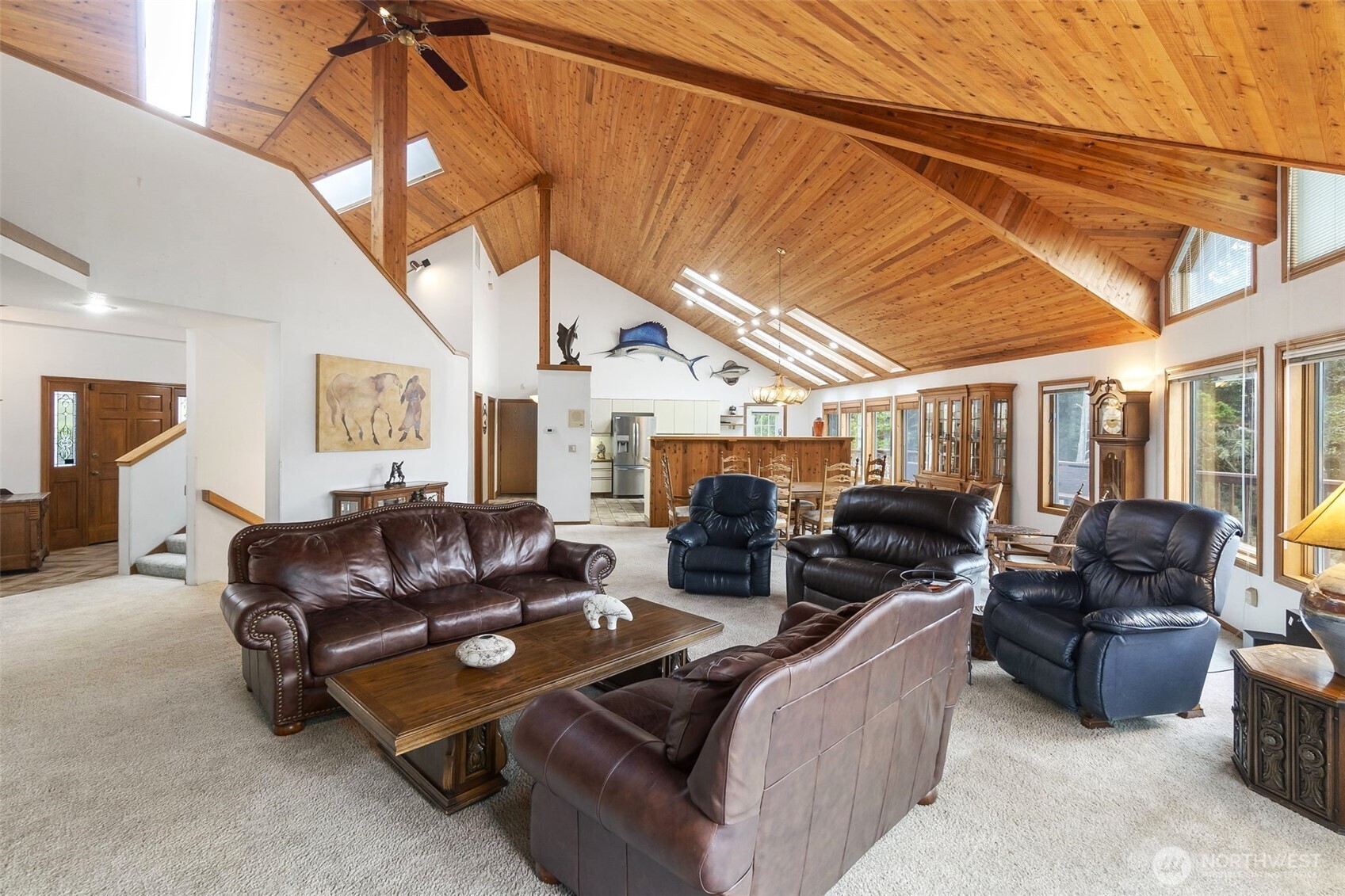 280 Surf Street Westport, WA 98595 - Photo 8 of 35 a living room with furniture a fireplace and a flat screen tv