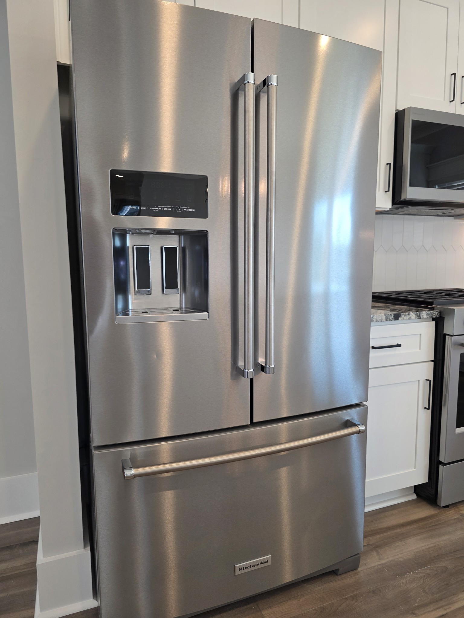 369 Springbrook Boulevard White House, TN 37188 - Photo 12 of 30 a view of a refrigerator in kitchen and wooden floor