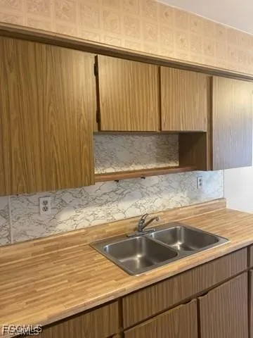 an empty room with a bathroom