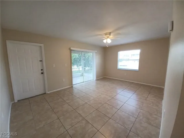 a bathroom with a granite countertop toilet and a sink