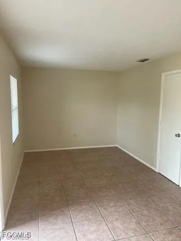 a view of a house with backyard and porch