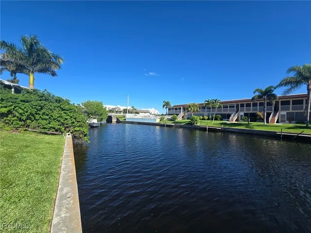 a view of a lake with a large building in the background
