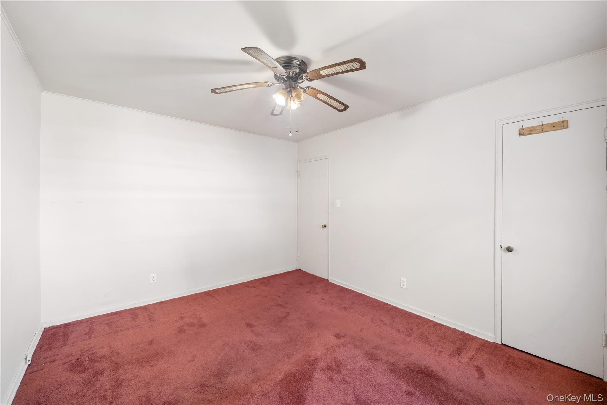 226-29 Manor Road, Unit UPPR Queens, NY 11427 - Photo 13 of 21 Carpeted spare room with a ceiling fan and baseboards