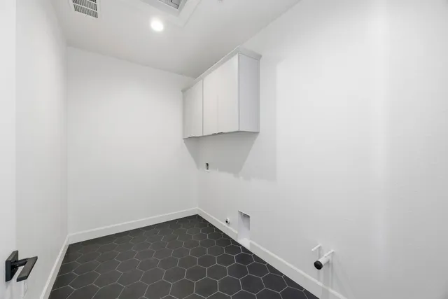 a view of room with wooden floor