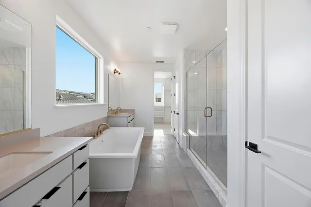 a bathroom with a sink a toilet a shower and a mirror