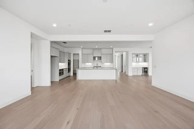 a view of a kitchen with wooden floor