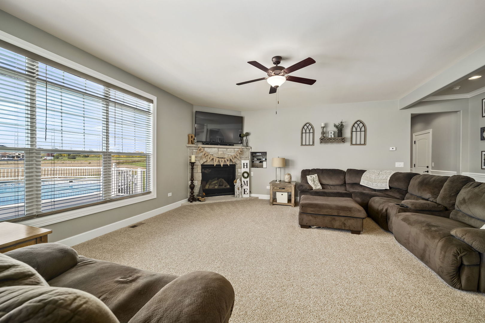 301 Arrowhead Drive Minooka, IL 60447 - Photo 15 of 43 a living room with furniture and a fireplace